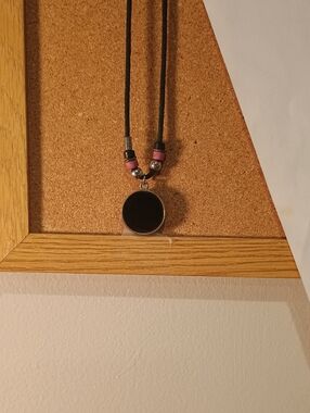 Black Round Pendant Necklace with Pink Bead Accents